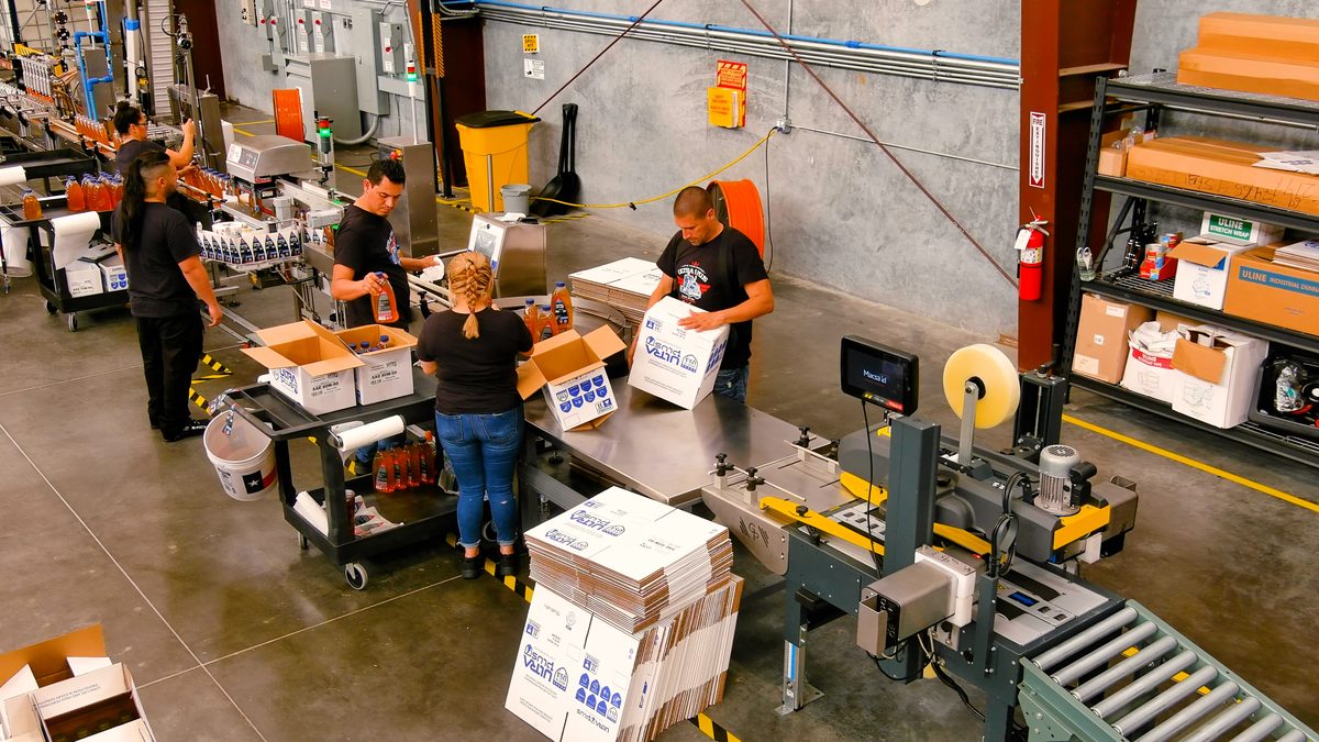 U1Dynamics team packing lubricant orders for distribution