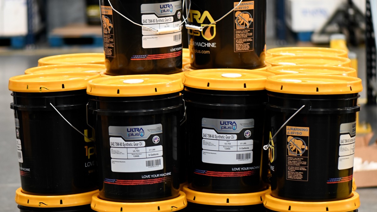 Ultra1Plus 5-gallon pails of synthetic gear oil stacked in warehouse