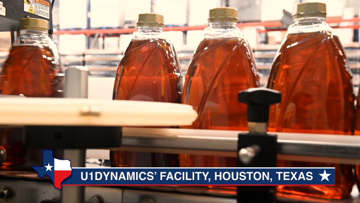 Quart bottles being filled on U1Dynamics production line